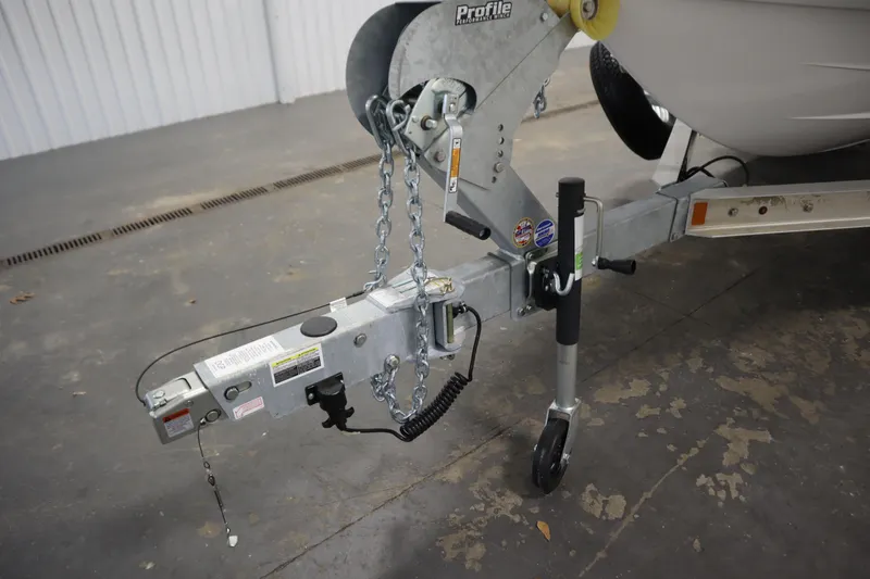 Slide: The Image of Trailer hitch of 2026 Yamaha Boats 220 FSH Sport in a garage setting. - 46