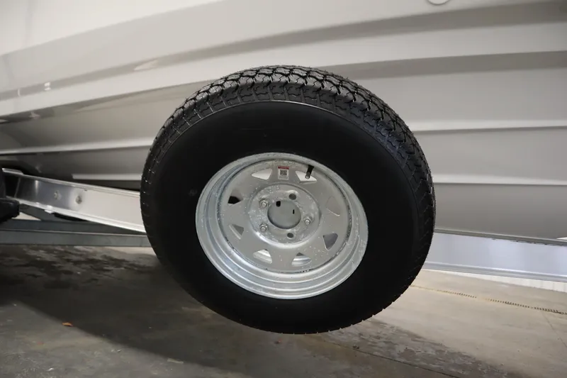 Slide: The Image of Trailer wheel of 2026 Yamaha Boats 220 FSH Sport, showcasing tire tread and rim. - 47