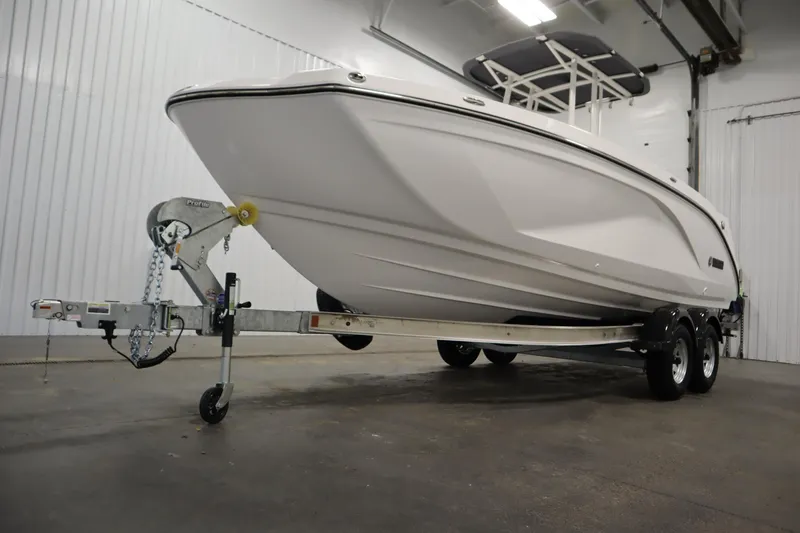 Slide: The Image of 2026 Yamaha Boats 220 FSH Sport on trailer in indoor storage facility. - 48