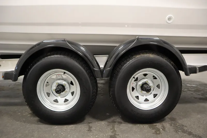 Slide: The Image of Trailer wheels of 2026 Yamaha Boats 220 FSH Sport, close-up view. - 49