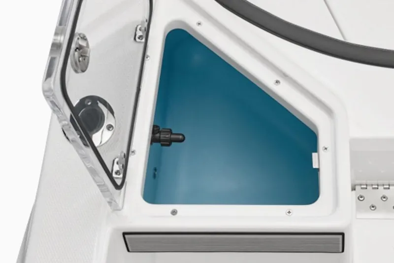 Slide: The Image of Open storage compartment on 2026 Yamaha Boats 220 FSH Sport, featuring sleek design and functionality. - 55