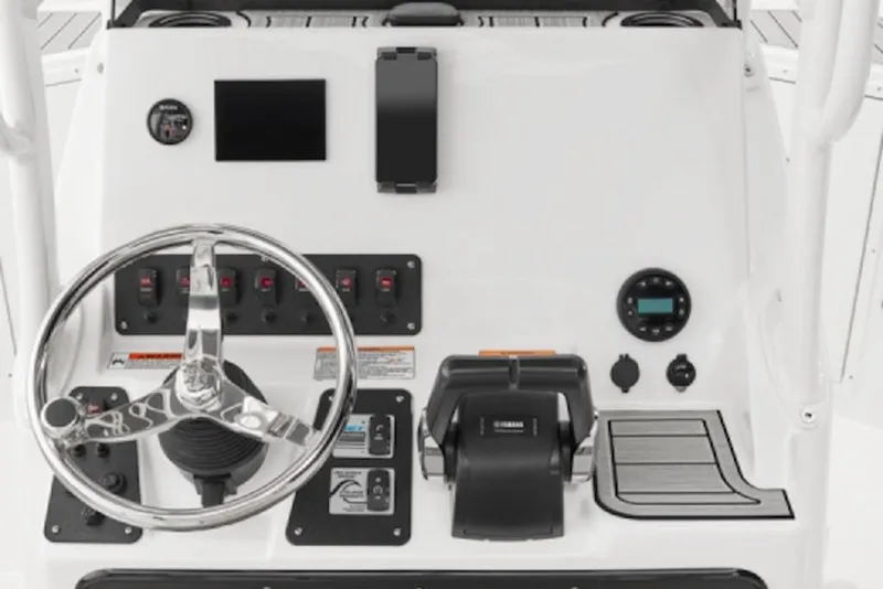Slide: The Image of 2026 Yamaha Boats 220 FSH Sport dashboard with steering wheel and controls. - 56