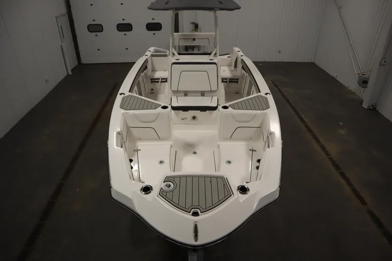 Slide: The Image of 2026 Yamaha Boats 220 FSH Sport, sleek design, spacious interior, in a showroom setting. - 8