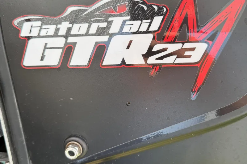 Slide: The Image of Close-up of GatorTail GTR23 logo on 2025 Alweld 1548 Invader boat. - 13