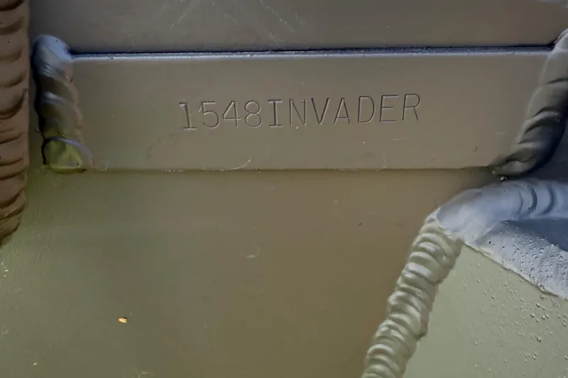 Slide: The Image of 2025 Alweld 1548 Invader boat model engraving detail. - 16