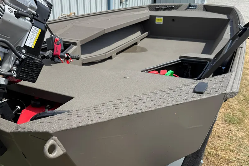 Slide: The Image of 2025 Alweld 1548 Invader boat interior with motor and storage compartments. - 3