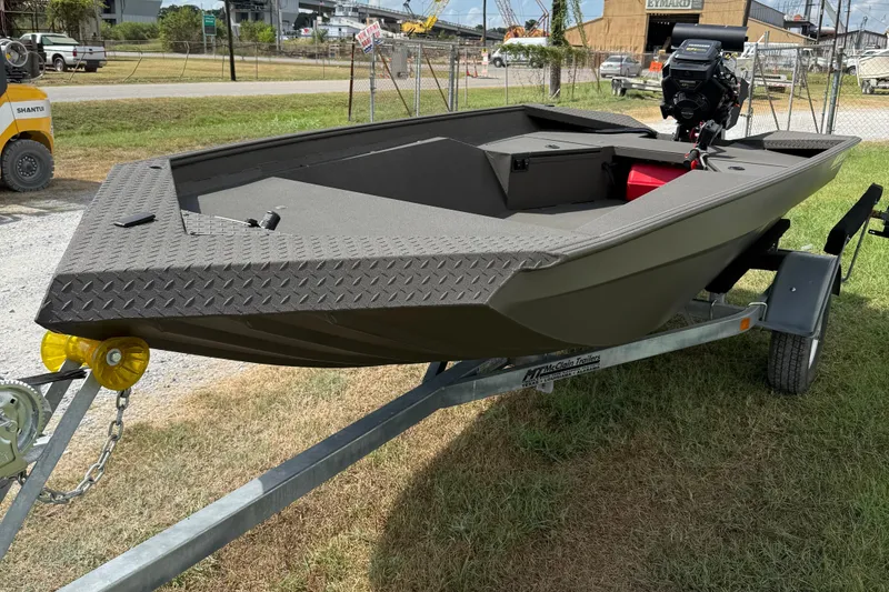 Slide: The Image of 2025 Alweld 1548 Invader boat on trailer, parked on grass. - 4