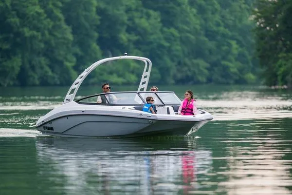 Slide: The Image of 2026 Yamaha Boats 195S cruising on a serene lake with passengers enjoying the ride. - 3