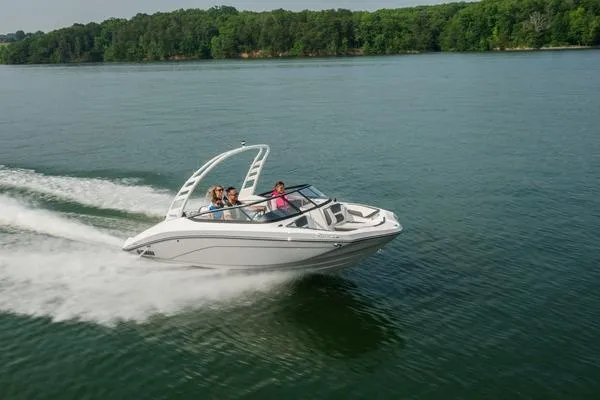 Slide: The Image of 2026 Yamaha Boats 195S cruising on a serene lake with lush green surroundings. - 4