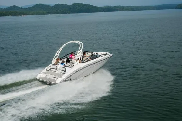 Slide: The Image of 2026 Yamaha Boats 195S speeding on a lake with scenic mountain backdrop. - 5