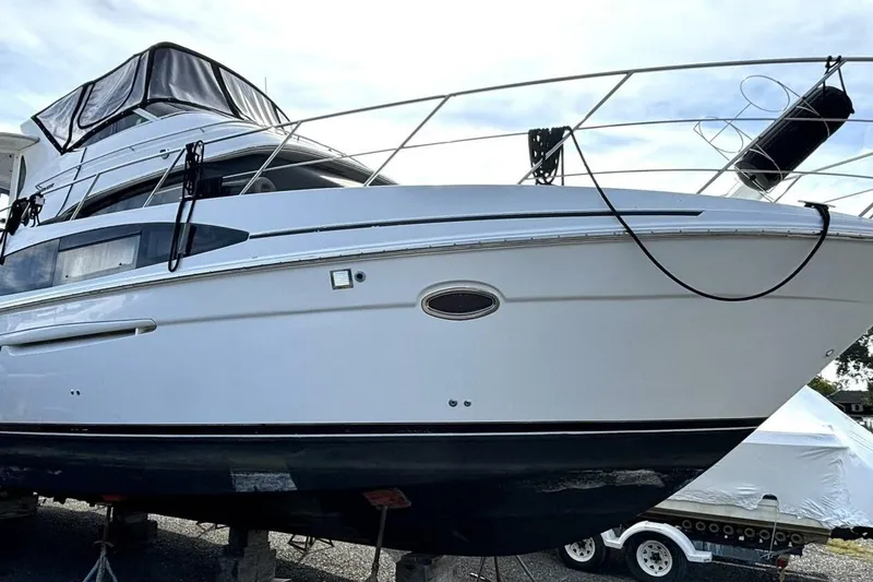 The Image of 2003 Carver 396 Motor Yacht on dry dock, showcasing sleek design and sturdy build. - 1