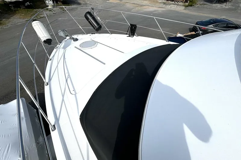 Slide: The Image of 2003 Carver 396 Motor Yacht deck view with railings and equipment. - 11