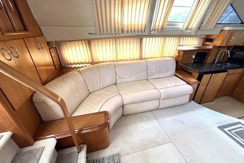 Slide: The Image of Luxurious interior of 2003 Carver 396 Motor Yacht with plush seating and elegant wood finishes. - 30
