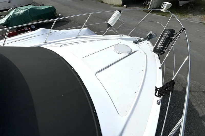 Slide: The Image of 2003 Carver 396 Motor Yacht deck with railings and equipment. - 14