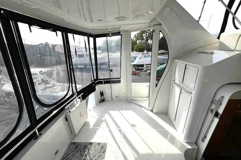 Slide: The Image of 2003 Carver 396 Motor Yacht interior with spacious, sunlit cabin and modern design. - 18