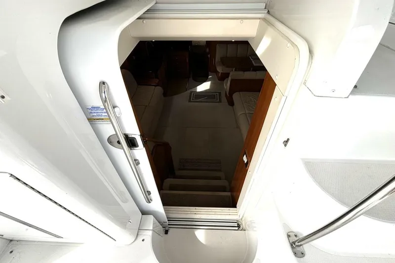 Slide: The Image of Entrance to 2003 Carver 396 Motor Yacht interior, showing stairs and seating area. - 28