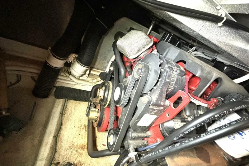 Slide: The Image of Engine compartment of a 2003 Carver 396 Motor Yacht, showing belts and hoses. - 52
