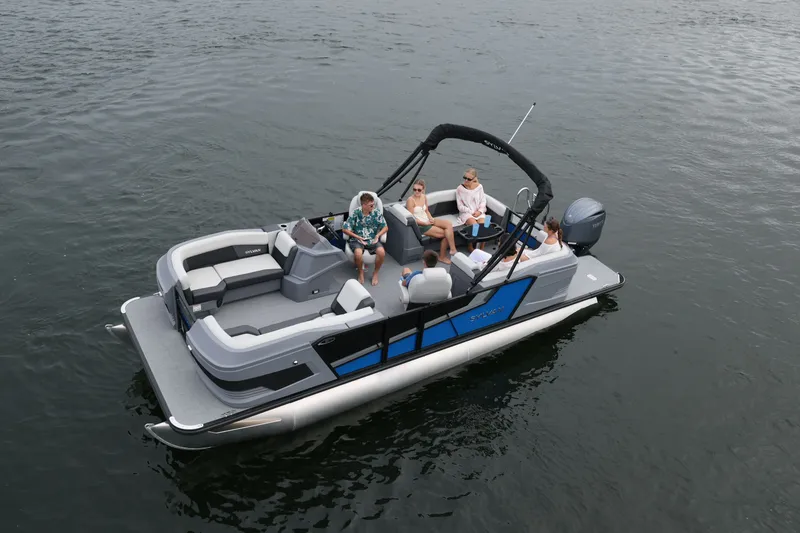 Slide: The Image of 2026 Sylvan R22 LZ DH pontoon boat on calm water. - 1