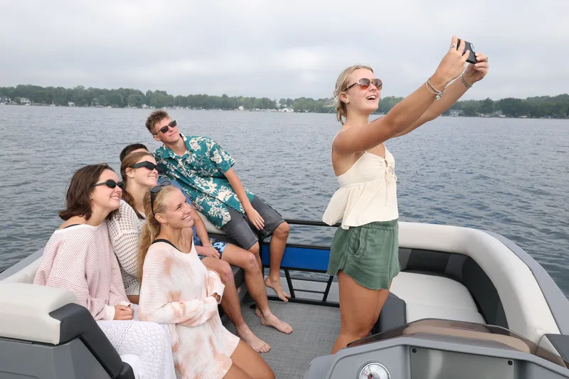Slide: The Image of Group of friends taking selfie on Sylvan R22 LZ DH boat. - 3