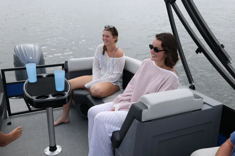 Slide: The Image of Two women relaxing on a 2026 Sylvan R22 LZ DH boat. - 9