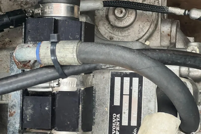 Slide: The Image of Close-up of a 2017 Ranger Tugs R-27 Tug engine component with hoses and clamps. - 23