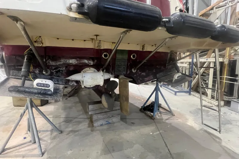 Slide: The Image of 2017 Ranger Tugs R-27 Tugboat under maintenance, showing propeller and hull details. - 28