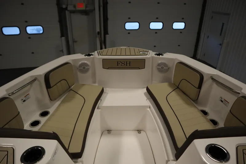Slide: The Image of 2026 Yamaha Boats 222 FSH Sport interior with beige seating and cup holders. - 10