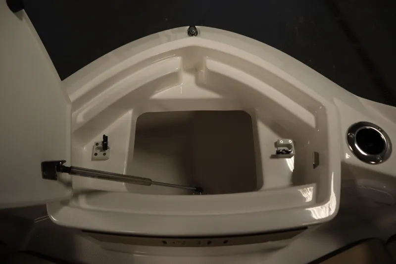 Slide: The Image of Open storage compartment on 2026 Yamaha Boats 222 FSH Sport, showcasing interior space. - 12