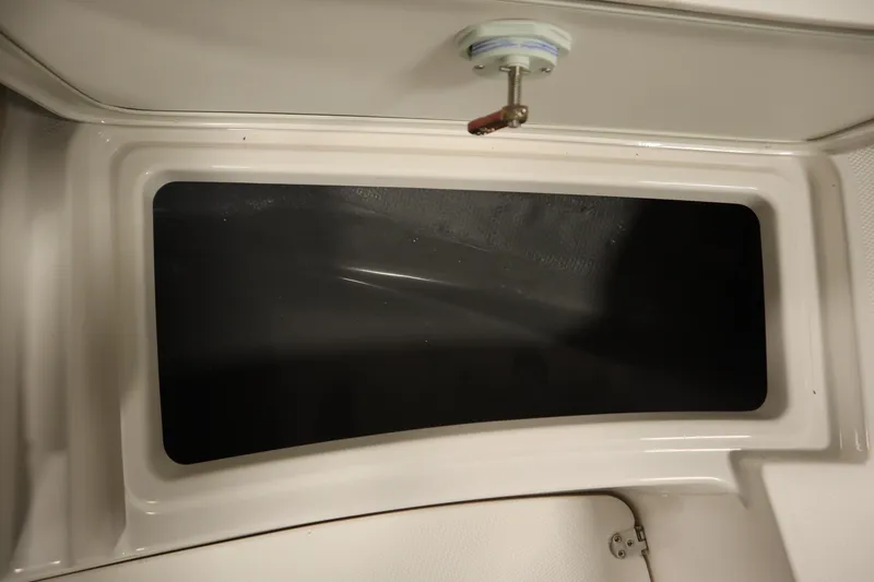 Slide: The Image of Yamaha Boats 2026 222 FSH Sport storage compartment interior view. - 13