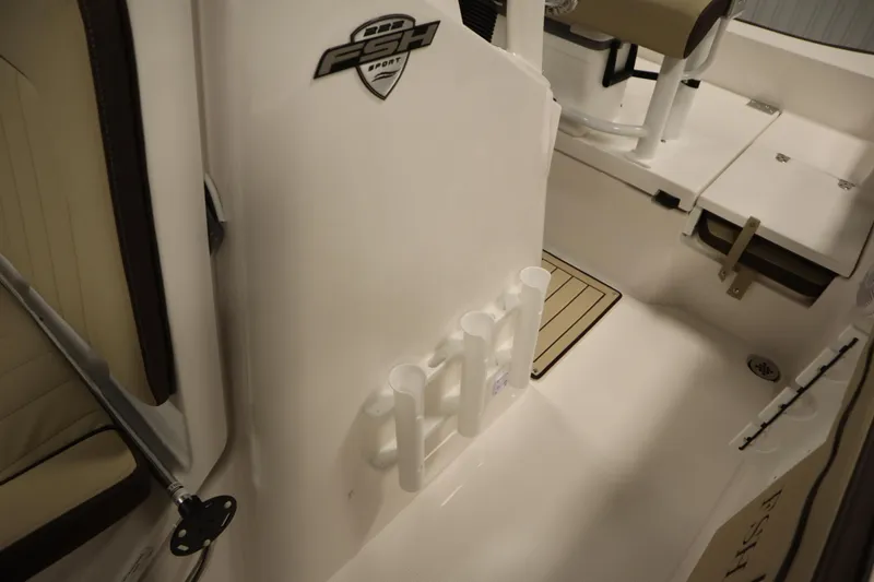 Slide: The Image of 2026 Yamaha Boats 222 FSH Sport interior with rod holders and seating. - 23