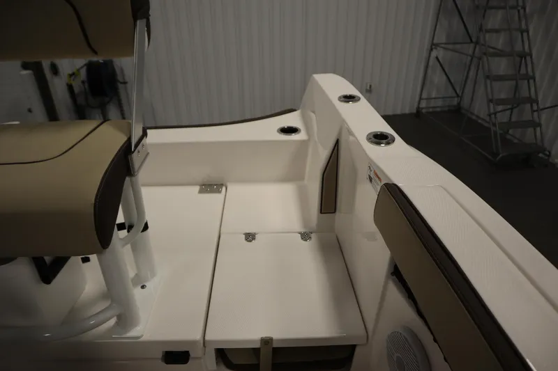 Slide: The Image of 2026 Yamaha Boats 222 FSH Sport interior with beige seating and cup holders. - 37