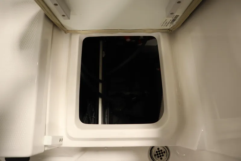 Slide: The Image of Open storage compartment in 2026 Yamaha Boats 222 FSH Sport. - 39
