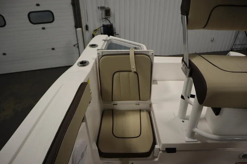 Slide: The Image of 2026 Yamaha Boats 222 FSH Sport interior seating, featuring beige and brown cushioned seats. - 41