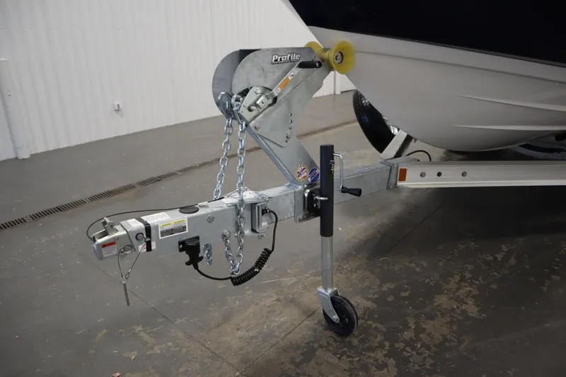 Slide: The Image of Trailer hitch of 2026 Yamaha Boats 222 FSH Sport in a garage setting. - 47