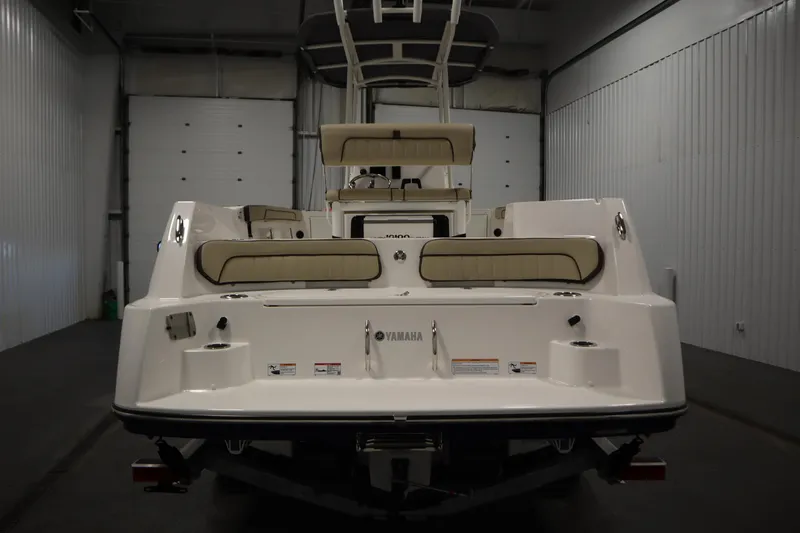 Slide: The Image of 2026 Yamaha Boats 222 FSH Sport, rear view in a garage setting. - 5