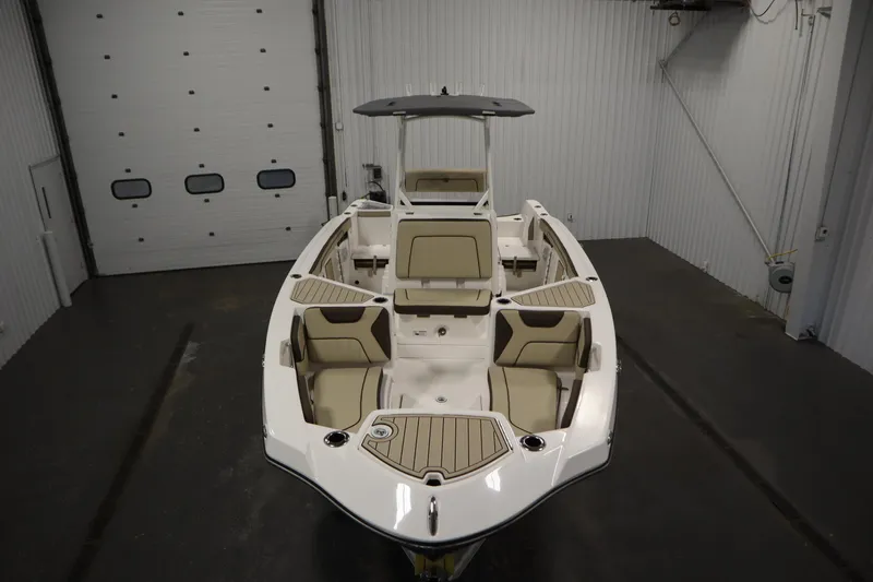 Slide: The Image of 2026 Yamaha Boats 222 FSH Sport in a showroom, showcasing sleek design and seating. - 8