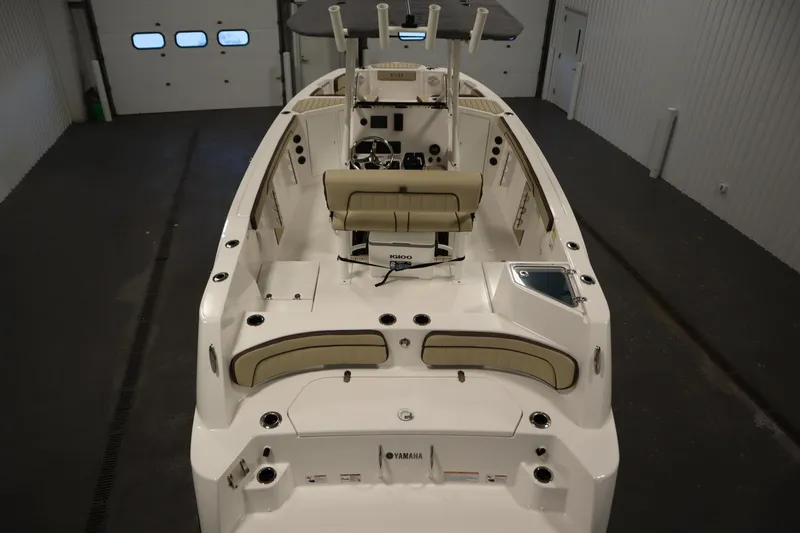 Slide: The Image of 2026 Yamaha Boats 222 FSH Sport interior view in a garage setting. - 9