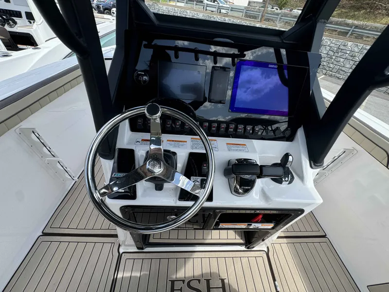 Slide: The Image of Yamaha 255 FSH Sport H 2026 helm with steering wheel and controls. - 25