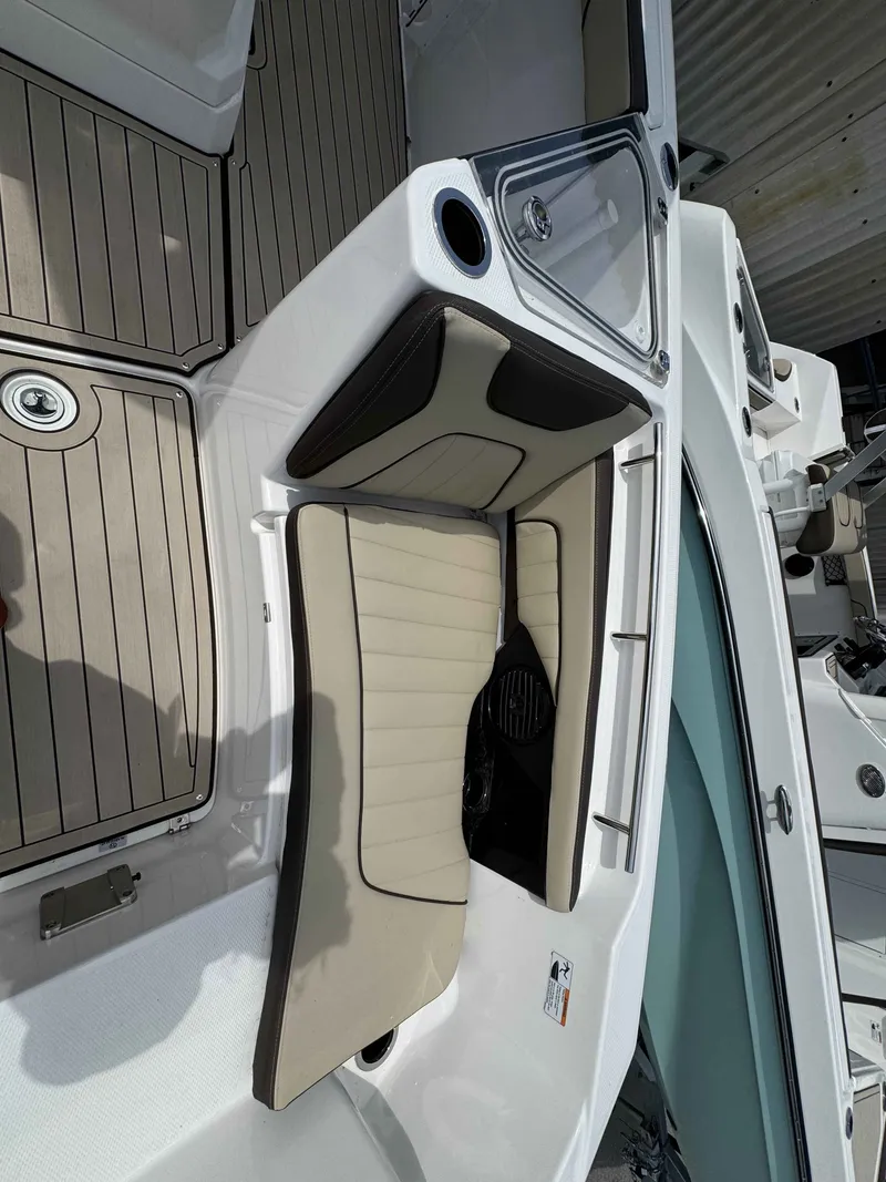 Slide: The Image of Interior of Yamaha Boats 255 FSH Sport H 2026 with seating cushions. - 29