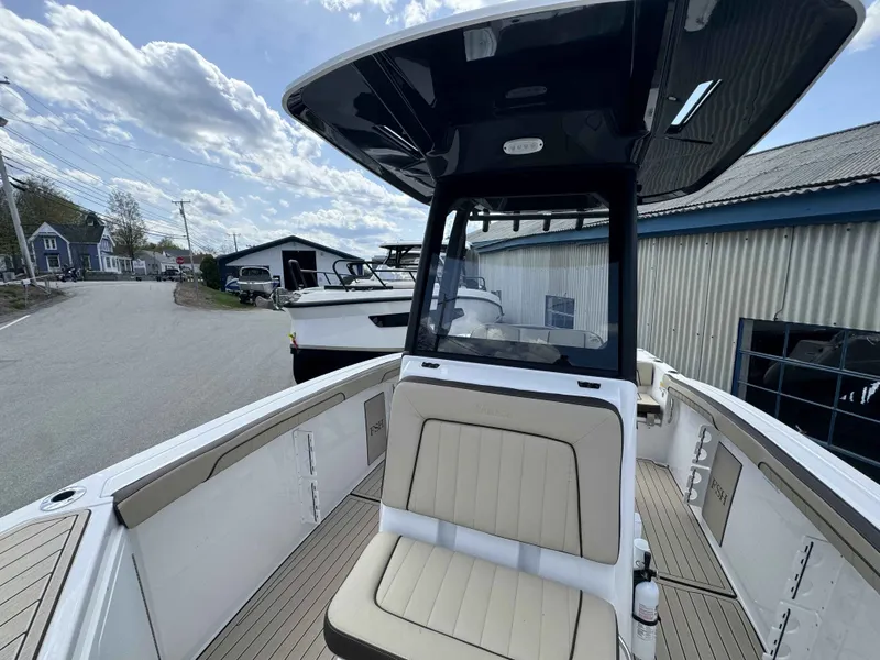 Slide: The Image of 2026 Yamaha Boats 255 FSH Sport H with sleek design at the dock. - 35