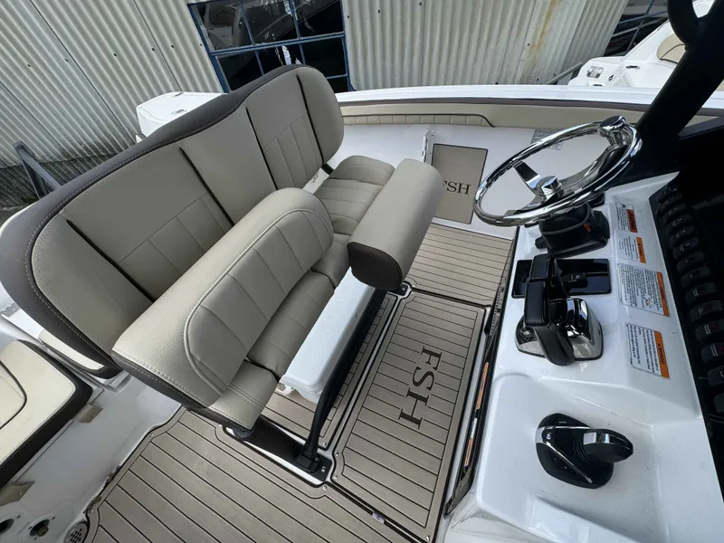 Slide: The Image of Interior of Yamaha Boats 255 FSH Sport H 2026 with helm console. - 37