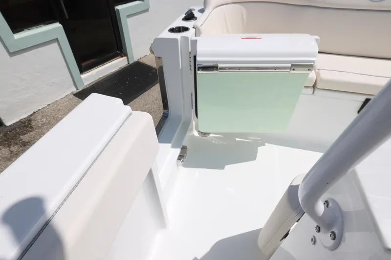Slide: The Image of 2026 Sea Hunt Ultra 245 SE boat console with Garmin electronics and control panel. - 12