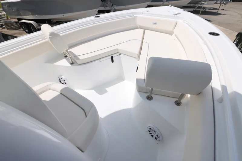 Slide: The Image of Sea Hunt Ultra 245 SE 2026 boat with holiday savings offer, valid until December 31. - 2