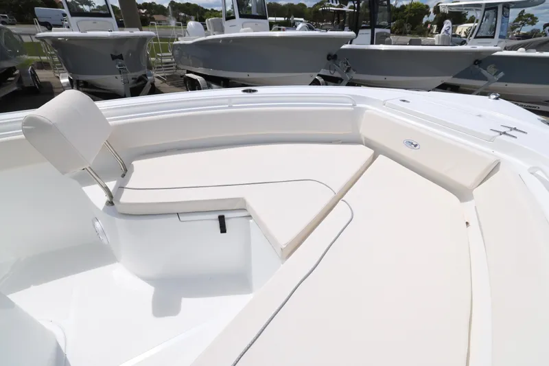 Slide: The Image of 2026 Sea Hunt Ultra 245 SE boat top with rod holders and speakers. - 21