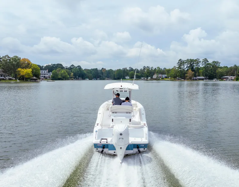 Slide: The Image of 2026 Sea Hunt Ultra 245 SE boat cruising on open water. - 27