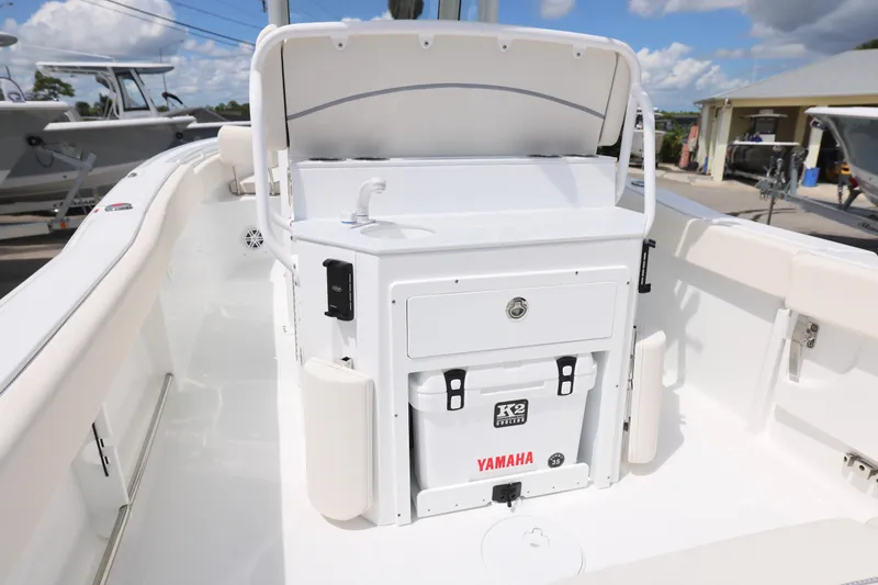 Slide: The Image of 2026 Sea Hunt Ultra 245 SE boat interior with white cushioned seating. - 3