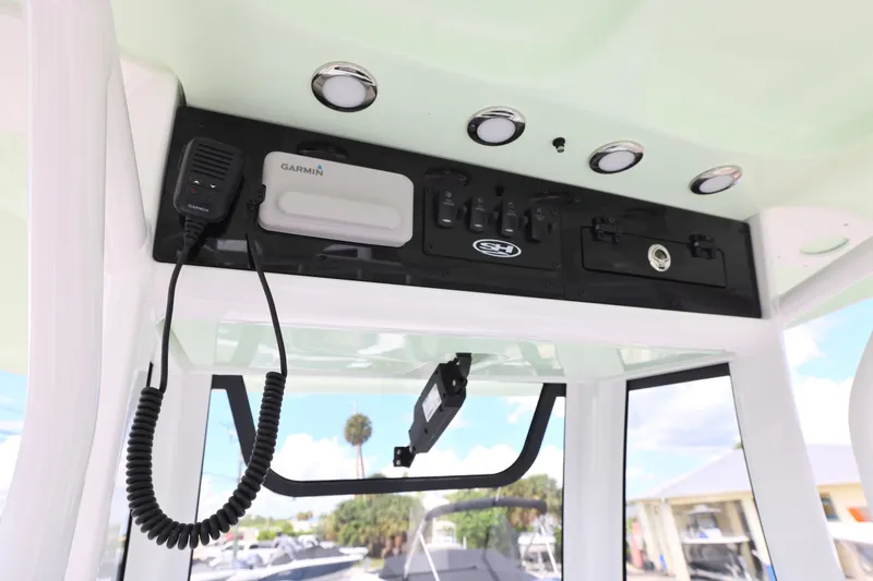 Slide: The Image of 2026 Sea Hunt Ultra 245 SE boat with spacious seating and modern design. - 9