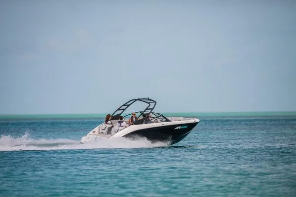 Slide: The Image of 2026 Yamaha Boats AR220 speeding on clear blue water. - 4