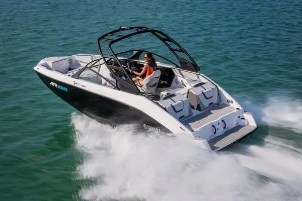 Slide: The Image of 2026 Yamaha Boats AR220 speeding on water, showcasing sleek design and performance. - 7