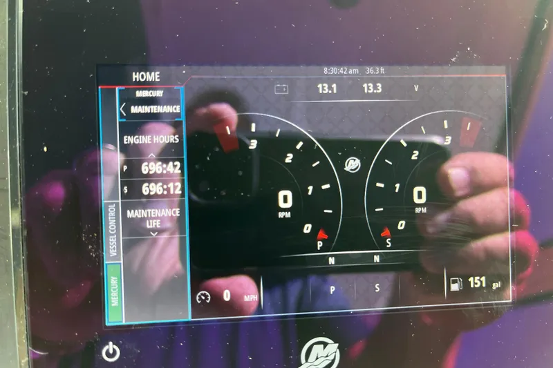 Slide: The Image of Dashboard of a 2010 Sea Ray 450 Sundancer showing engine hours and RPM gauges. - 10